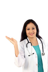 Young doctor woman presenting and showing copy space