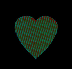 abstract green heart of the goffered cardboard isolated on a black background. the concept of love, Valentine's day