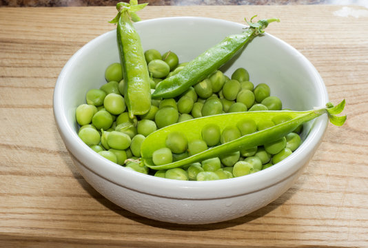 Green peas and pod on a plate