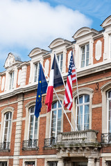 Fototapeta na wymiar Three flags on a building in France