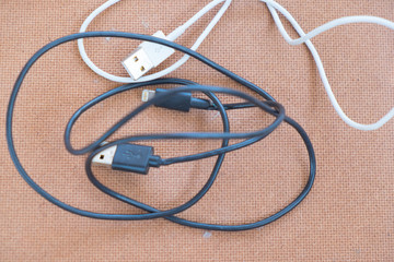 usb cable port charger on wood background