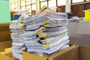 Pile of documents on desk at workplace