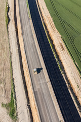 aerial view of the highway  and harvest fields