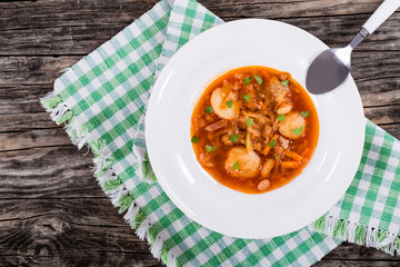 Ukrainian vegetable and meat soup borscht , close-up