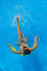 Beautiful young woman in bikini Relaxing in a pool