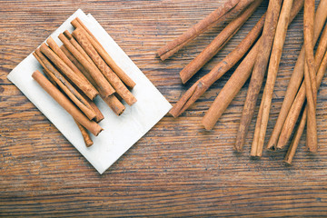 Cinnamon sticks on rustic paper close up with copy space