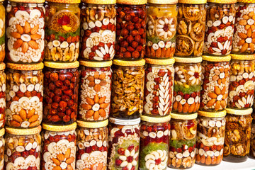 Homemade honey with dried fruits and nuts on the market