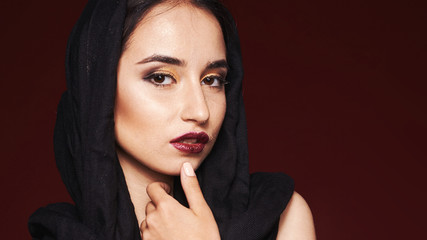 Fototapeta na wymiar beautiful woman wearing kashmir scarf isolated on grey