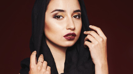 Fototapeta na wymiar beautiful woman wearing kashmir scarf isolated on grey