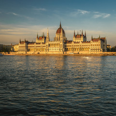 Fototapeta na wymiar Hungarian Parliament Building in Budapest along Danube River at sunset.