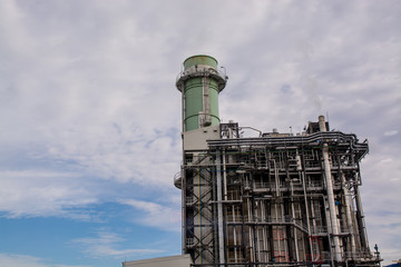 view of pipelines and towers, heavy industry.