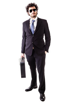 cool businessman with secured leather suitcase