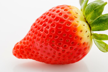 Closeup of not fully ripe strawberry