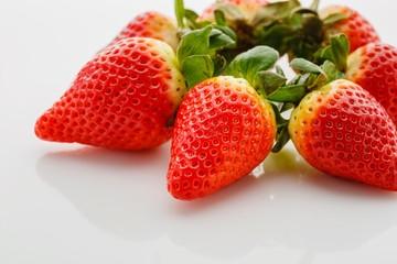 Closeup of not fully ripe strawberries