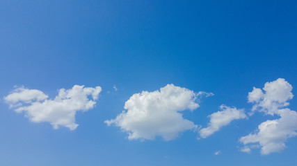 White clouds with blue sky background.