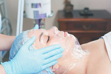 Woman in spa salon receive skin treatment.
