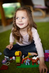 Cute little girl playing and having fun at home © enyezdi