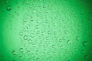 Raindrops on green glass, Water droplets on green glass for a ba