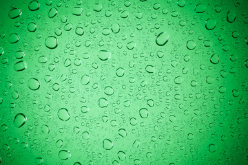 Raindrops on green glass, Water droplets on green glass for a ba