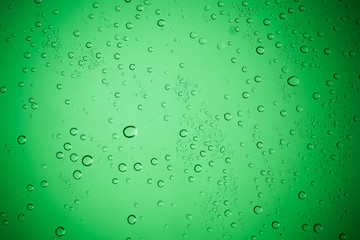 Raindrops on green glass, Water droplets on green glass for a ba