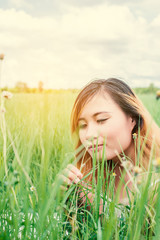 young beautiful woman sitting on grassland enjoy nature and fres