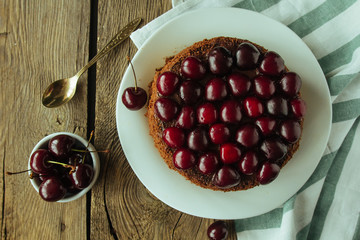 Chocolate cake with black cherry on white dish