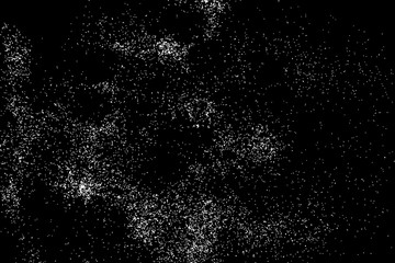 Abstract grainy texture isolated on black background. Silhouette of food flakes such as salt or almond or wheat flour spread on the flat surface or table. Top view. Dust, sand blow or bread crumbs.