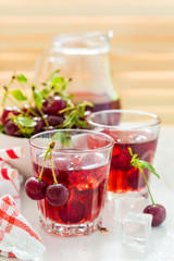 Cold cherry summer drink in glasses