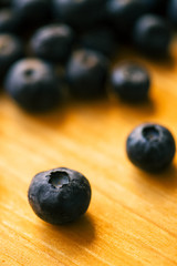 Blueberries on wooden table, macro