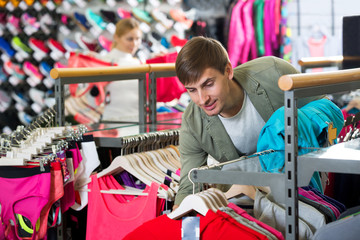 Man choosing a sporty jacket