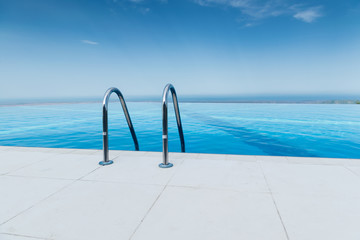 Infinity pool on the bright summer day