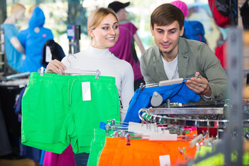 Fototapeta premium Couple trying items in the sport shop.