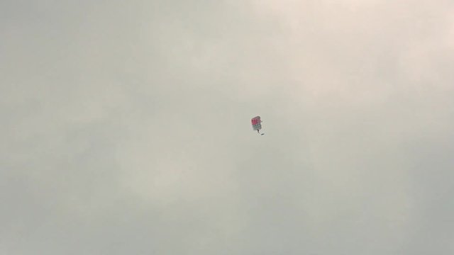Parachutist soars in the sky