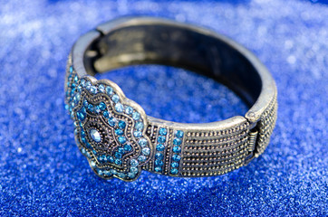 Jewellery ring against blue background