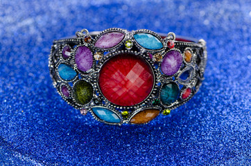 Jewellery ring against blue background