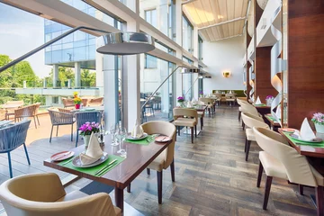 Foto op Plexiglas Modern restaurant interior on balcony, part of a hotel © arizanko