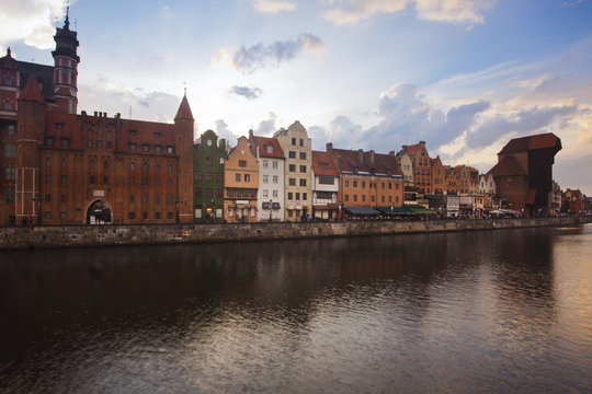 The free city of Gdansk's medieval center down by the Motlawa river at sunset 