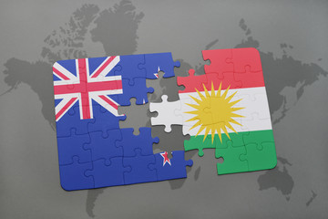 puzzle with the national flag of new zealand and kurdistan on a world map background. 3D...