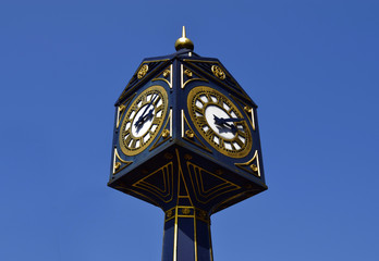 Big clock in Walsall  on sunny day .  Big clock on the blue sky in United Kingdom