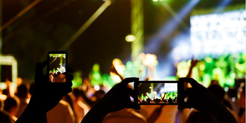 Take photo in front of concert stage