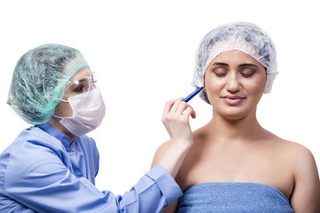 Young woman preparing for plastic surgery isolated on white