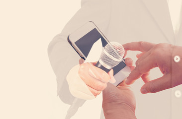 Double exposure hand using mobile phone and business man.