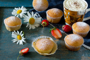 Delicious cake with strawberries on a vintage wooden background