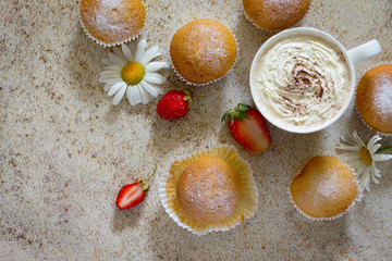 Delicious cake with strawberries on brown stone background. View