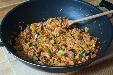 Delicious rice with stewed vegetables and sausages