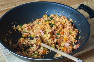 Delicious rice with stewed vegetables and sausages
