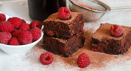 Chocolate brownie with raspberries and dark beer. Selective focus
