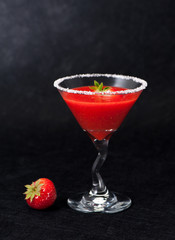 Strawberry smoothie in a glass goblet