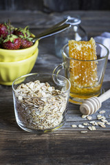 Cereals,fruit,milk and honey for breakfast