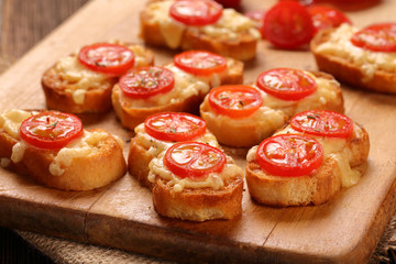 Grilled toast with cheese and tomatoes